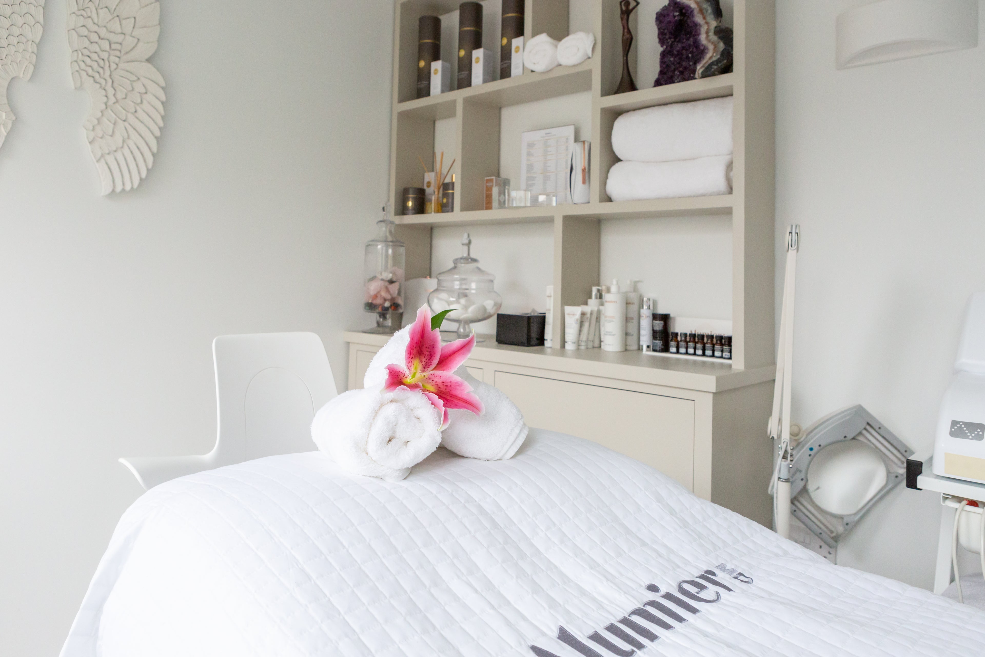 Caroline Conrad Treatment Bed with display cabinet in background