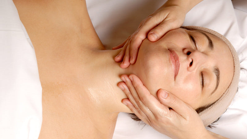 Facial on a woman with therapists hands